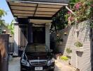 Modern three-story house with carport and lush landscaping