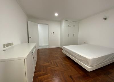 Spacious Bedroom with Parquet Flooring