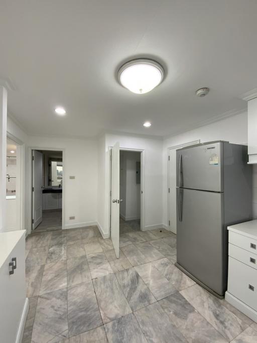 Spacious kitchen with modern appliances and tiled flooring