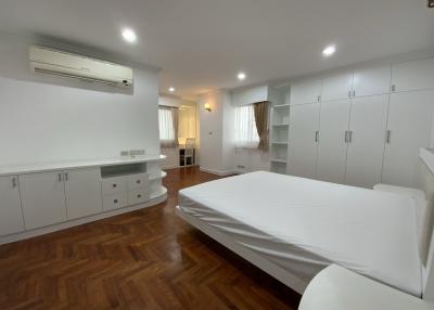 Spacious bedroom with built-in wardrobe and air conditioning