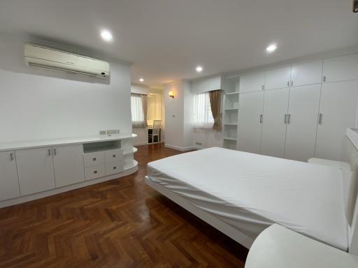 Spacious bedroom with built-in wardrobe and air conditioning