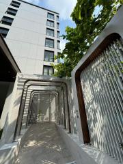 Modern apartment building entrance with geometric walkway design