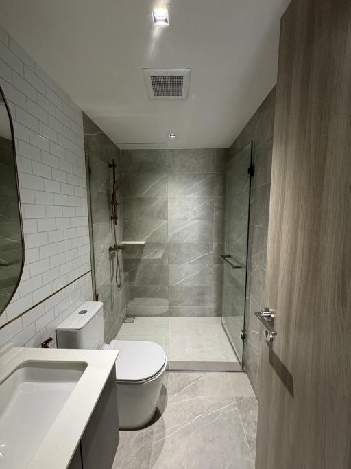 Modern bathroom with walk-in shower and neutral colors