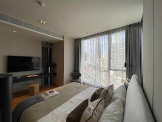 Modern bedroom with large windows and city view