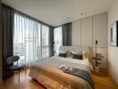 Modern bedroom with large windows and city view