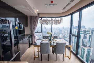 Elegant dining area with cityscape view through floor-to-ceiling windows