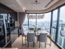 Elegant dining area with cityscape view through floor-to-ceiling windows