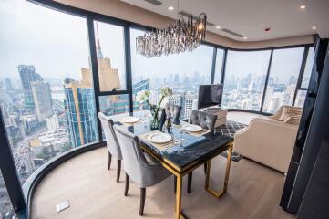 Modern dining area with office nook overlooking a city skyline