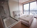 Modern bedroom with en-suite bathroom and city view