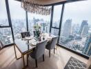 Elegant dining room with panoramic city views through floor-to-ceiling windows