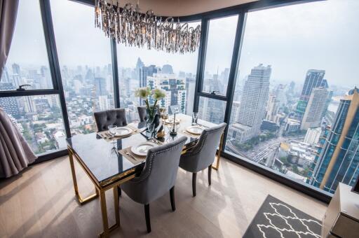 Elegant dining room with panoramic city views through floor-to-ceiling windows