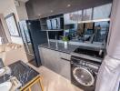 Modern kitchen with stainless steel appliances and marble countertop