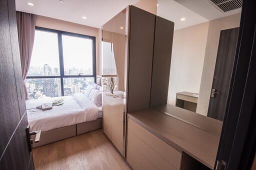 Modern bedroom with city view and ample natural light