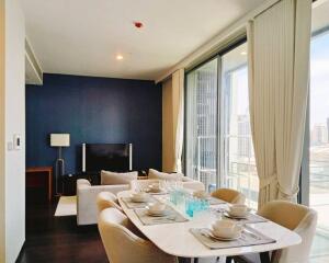 Contemporary living room with dining area and large windows