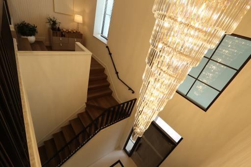 Elegant staircase with a luxurious chandelier and modern design