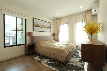 Modern bedroom with natural light and stylish decor