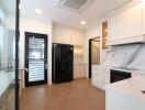 Modern kitchen with marble countertops and stainless steel appliances