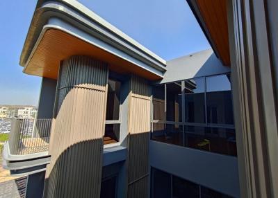 Modern apartment building facade with balconies and unique architectural design