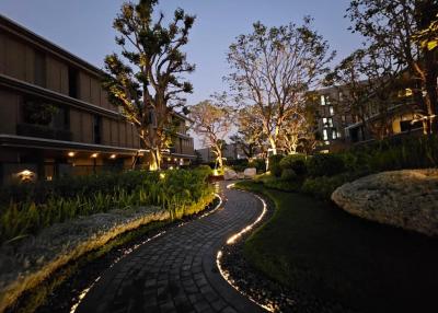 Well-maintained garden path of a residential building at twilight