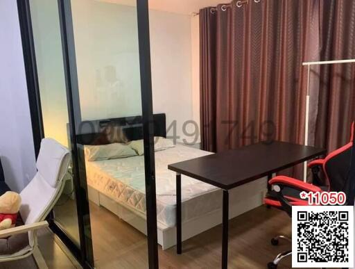 Compact bedroom with glass partition and modern furnishings