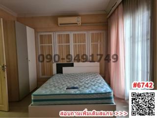 Spacious bedroom with king-sized bed, built-in closets and air conditioning