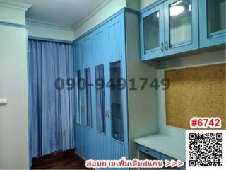 Spacious kitchen with blue cabinets and ample storage space