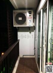 Compact balcony with air conditioning unit and tiled floor