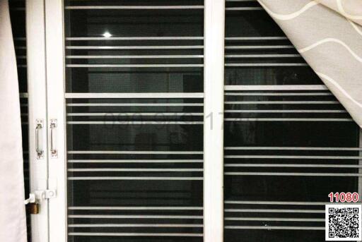 Close-up view of a window with horizontal blinds