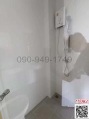 Modern bathroom with white tiles and shower