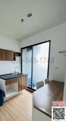 Modern Kitchen with Wooden Cabinets and Large Window