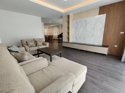 Spacious living room interior with modern furniture and elegant design