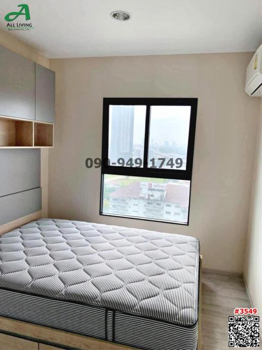 Modern bedroom with a large window and city view