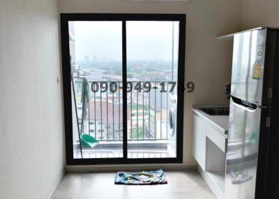 Compact balcony with city view and sliding doors