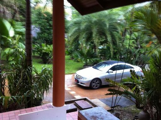 View of the house exterior with car parked on driveway