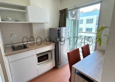 Modern kitchen with appliances and dining area