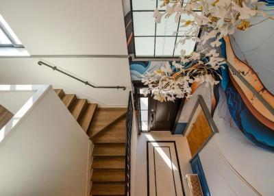 Modern staircase in a house with artistic wall decor