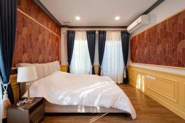 Elegant bedroom with modern design and warm color scheme