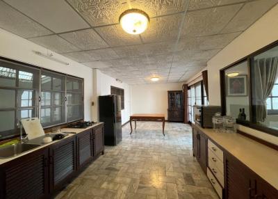 Spacious living room with decorative ceiling and tile flooring