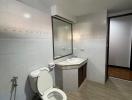 Modern bathroom interior with tiled walls and floor