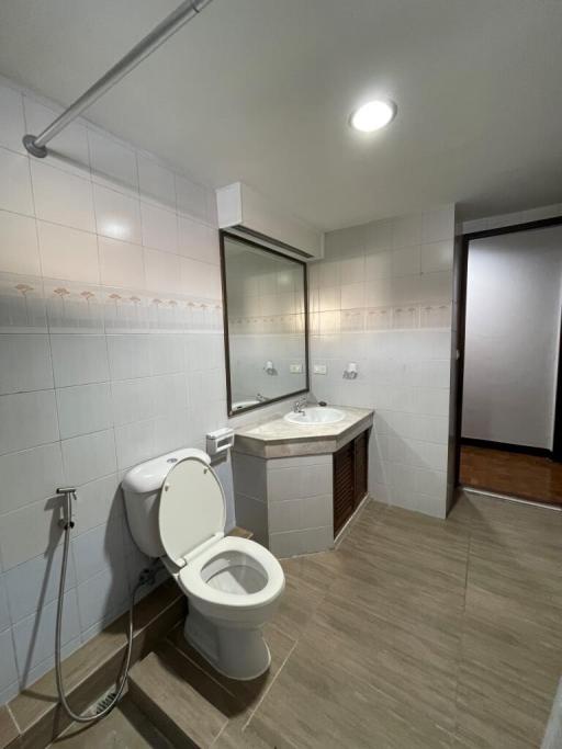 Modern bathroom interior with tiled walls and floor