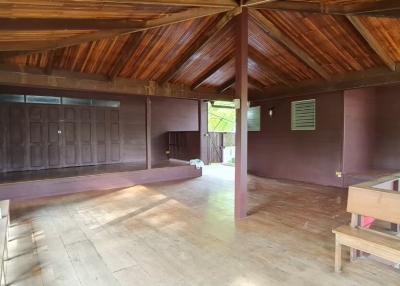 Spacious wooden interior of a building with high ceiling