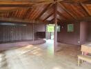 Spacious wooden interior of a building with high ceiling