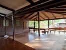 Spacious and well-lit wooden living room interior with open layout