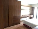 Modern bedroom with large wardrobe and wooden features