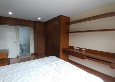 Spacious bedroom with built-in wardrobes and attached bathroom