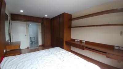 Spacious bedroom with built-in wardrobes and attached bathroom