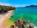 Aerial view of a tropical beach with clear waters