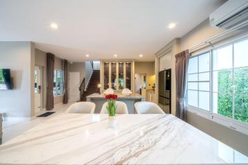 Modern kitchen with marble island and open concept layout