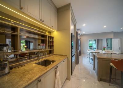 Modern kitchen with marble countertops and LED lighting