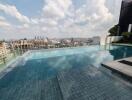 Luxury rooftop swimming pool with city skyline view